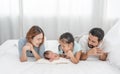 Parent and children relaxing together. Portrait of a young family with mother, father, son and daugther. Parents having happy time Royalty Free Stock Photo