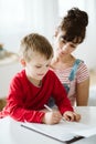 Parent is helping kid use and practice what he learn during ADHD therapy