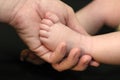 Parent Holding Baby's Foot