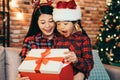 Child in a Santa hat surprised and excited. Royalty Free Stock Photo