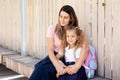 Parent mother taking child to school. Pupil girl of primary school go study with blue backpack outdoors. Back to school. First day Royalty Free Stock Photo