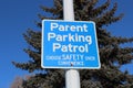 Parent Parking Patrol Sign Against Tree and Blue Sky Royalty Free Stock Photo