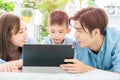 Parent play with child by tablet