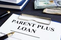 Parent plus loan form and documents in office.