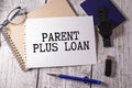 Parent PLUS Loans sign on the piece of paper