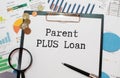 Parent PLUS Loans sign on the piece of paper