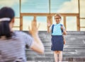 Parent and pupil go to school