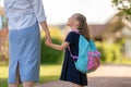 Parent and pupil going to school