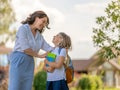 Parent and pupil going to school