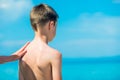 A parent smears a child with sunscreen. Sun protection. Preventing sunburn Royalty Free Stock Photo