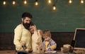 Parent support concept. Parents watching their son drawing, learning to write, chalkboard on background. Boy on busy Royalty Free Stock Photo