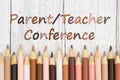 Parent Teacher Conference message with multiculture skin tone color pencils Royalty Free Stock Photo