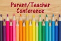 Parent teacher conference message with pencil crayons