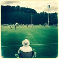 Parent watching Lacrosse game