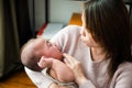 Parent woman cuddling baby tenderness Royalty Free Stock Photo