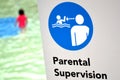 Parental supervision in swimming pool Royalty Free Stock Photo