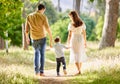 Parenthood is the best journey. a family taking a walk in the park. Royalty Free Stock Photo