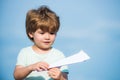 Parenthood and childhood concept. Dreams of traveling. Happy kid on summer field - dream of flying concept. Happy child Royalty Free Stock Photo