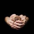 Parenthood concept. Newborn baby on father`s hand on black background Royalty Free Stock Photo