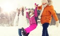 Happy family in winter clothes walking outdoors Royalty Free Stock Photo