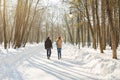 Parenthood, season and people concept - happy family with child in winter clothes outdoors Royalty Free Stock Photo