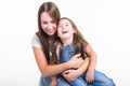 Parenting, family and children concept - Portrait of a mother and her baby girl have fun and smiling over white Royalty Free Stock Photo