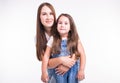 Parenting, family and children concept - Portrait of a mother and her baby girl have fun and smiling over white Royalty Free Stock Photo