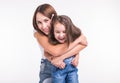 Parenting, family and children concept - Portrait of a mother and her baby girl have fun and smiling over white Royalty Free Stock Photo