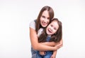 Parenting, family and children concept - A portrait of a mother and her baby girl have fun and smiling over white Royalty Free Stock Photo