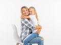 Parenting, family and children concept - Portrait of a mother and her child girl have fun and smiling over white Royalty Free Stock Photo