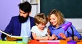 Parenting. Parents helping son to make homework. Family school. First time to school. Royalty Free Stock Photo