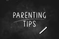 PARENTING TIPS written with chalk on blackboard icon logo design vector illustration Royalty Free Stock Photo