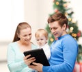 Parents and adorable baby with tablet pc Royalty Free Stock Photo