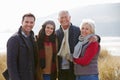 Parents With Adult Offspring Standing In Dunes Royalty Free Stock Photo