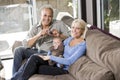 Parents and baby on lap at home, dad with camera Royalty Free Stock Photo