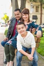 Parents Behind Their Cute Son on a Park Bench Royalty Free Stock Photo
