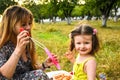 Parents blowing soap bubbles to child. Family love first. Family activity leisure outdoor in autumn park. Mother, father and two Royalty Free Stock Photo