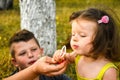 Parents blowing soap bubbles to child. Family love first. Family activity leisure outdoor in autumn park. Mother, father Royalty Free Stock Photo