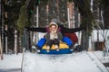 Parents bought their children tubing and now the whole family ride down the ice slide