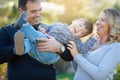 Parents, boy and fun for family and bonding, outside and nature garden for weekend care. Mother, father and love with Royalty Free Stock Photo