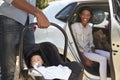 Parents Bringing Newborn Baby Home In Car Royalty Free Stock Photo