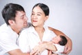 Parents carrying baby. portrait of young family with little son. selective focus of of happy young father kiss mother and hugging Royalty Free Stock Photo