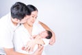 Parents carrying baby. portrait of young family with little son. selective focus of of happy young father kiss mother and hugging Royalty Free Stock Photo