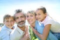 Parents carrying children on their back Royalty Free Stock Photo