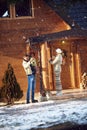 Parents and child decorate home together outdoor for Christmas