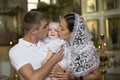 Parents with a child in an Orthodox church