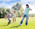 Parents with child playing with soccer ball Royalty Free Stock Photo