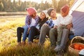 Parents With Children Camping By Lake