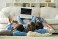 parents with children with laptops are lying on the back Royalty Free Stock Photo