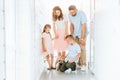 parents and children looking at adopted pug dog in corridor of animals Royalty Free Stock Photo